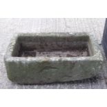 A rectangular stone trough,