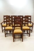 A set of eight oak ladder back dining chairs, including two with arms,