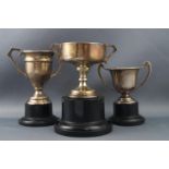 Three silver two handled trophy cups, 8cm and smaller, Birmingham 1931 and two Birmingham 1934,