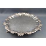 A George III silver salver with flower head and acanthus scroll cast rim,
