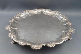 A George III silver salver with flower head and acanthus scroll cast rim,