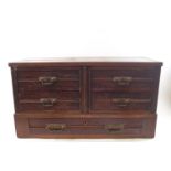 An Edwardian mahogany table top chest of five drawers by Maple & Co, stamped to bottom drawer,