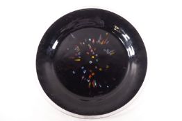 A large Murano glass dish, the centre with millefiori sections on a black ground,