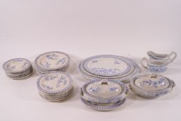A Victorian child's earthenware dinner service with transfer print blue flower design,