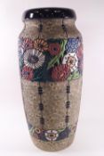 An Amphora of Austria pottery vase, typically decorated with stylised bands of flowers,