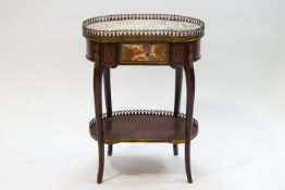 A French kidney shaped mahogany and gilt metal mounted two tier table,