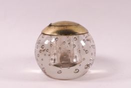 An early 19th century spherical glass inkwell, brass mounted with glass liner,