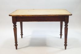 A Victorian pine kitchen table with drawer, on turned legs,