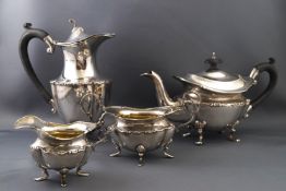 A silver four piece tete a tete tea set, by E S Barnsley & Co,
