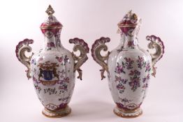 A pair of 19th century Sampson porcelain vases and covers, decorated predominantly in pink,