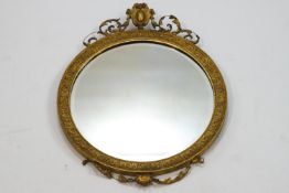 A 19th century circular giltwood wall mirror,