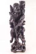 A 20th century Japanese carved hardwood figure of a man with a staff, 47.