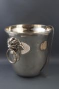 A small modern silver plated ice bucket and tongs, the bucket with mythical beast mask ring handles,