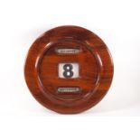 A large mahogany cased wall mounted calendar, with rolling date and days,