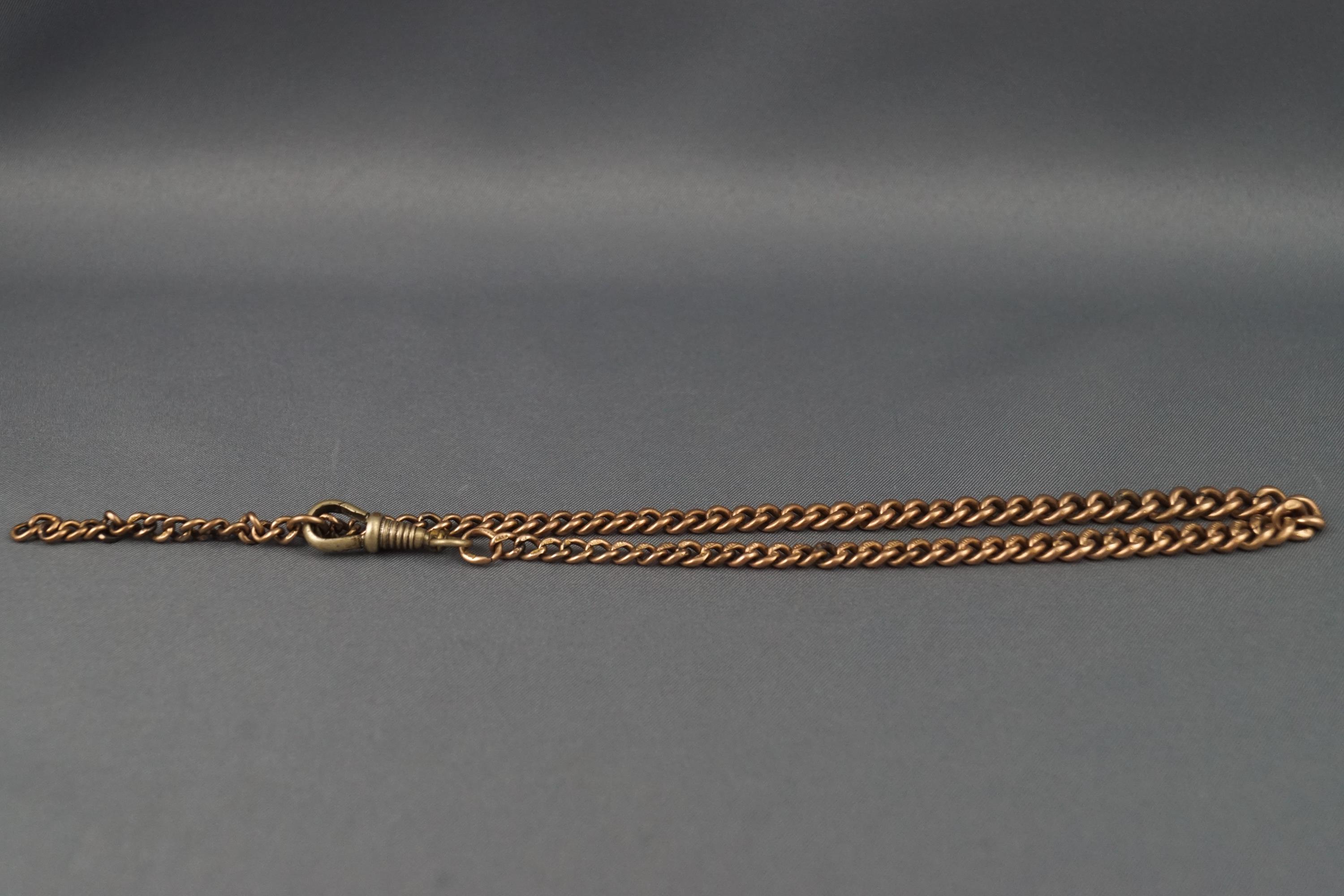 A yellow metal albert chain measuring 370mm. Each link hallmarked 9ct gold.