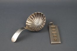 A George III silver caddy spoon by Thomas Willmore, with round fluted bowl, Birmingham 1802,