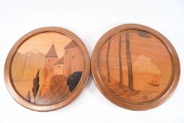 A pair of A J Rowley inlaid roundel pictures, 'Treasure Island' and 'Castle by the Lake',