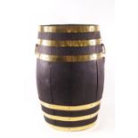 A brass bound barrel stick stand, with brass handles,