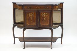 A Victorian inlaid rosewood side cabinet with central drawer above a cupboard,