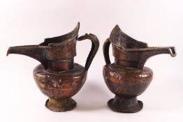 A pair of Islamic brass water jugs,