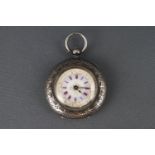 A ladies silver open face pocket watch with white ceramic dial having red Roman numerals and gold