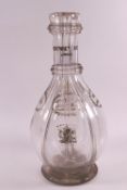 An Edwardian four sided glass decanter with engraved decanter labels and lettering for Humphrey
