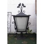An ornate wrought iron garden lamp,