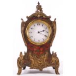 A French eight day boulle mantel timepiece, the case in Louis XVI syle with brass mounts and finals,