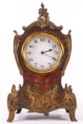 A French eight day boulle mantel timepiece, the case in Louis XVI syle with brass mounts and finals,