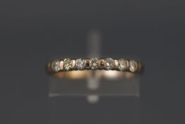 A white metal half hoop diamond ring approx 0.35ct. Hallmarked 18ct gold, Birmingham. Size: L 2.