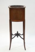 An Edwardian in-laid mahogany wine cooler with brass liner,