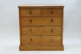 A Victorian pine chest of two short over three long drawers, 107cm high x 106cm wide x 52.