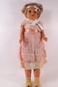 A 1950's Continental composite doll with original clothes including shoes and socks,