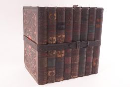 A Huntley & Palmers biscuit tin, modelled as eight books with a leather effect strap around them,
