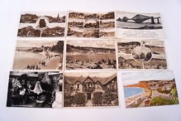 A small collection of postcards, mainly views, 'A Happy Smile from Clovelly',