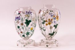 A pair of Victorian clear glass vases, painted with enamel flower decoration ,