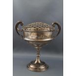 A silver cup with two flying scroll handles, on slender stem and flared foot, London 1903,