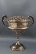 A silver cup with two flying scroll handles, on slender stem and flared foot, London 1903,