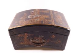 A Chinese lacquered wooden box with brass side handles,