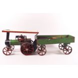 A Mamod tin plate traction steam engine and cart, with original paper leaflet,