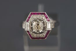 A white metal ruby and diamond dress ring.