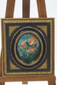 An oval print of a flower fairy on ceramic panel, within an ornate gold and black painted frame,