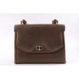 A Gucci taupe ladies handbag with beech handle and brass fittings,