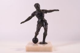 A French Spelter figure of a footballer on hardstone base