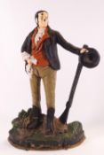 A cast iron doorstop, modelled as a Country Gentleman with his rifle