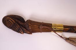 A walking cane with an Eagle knop