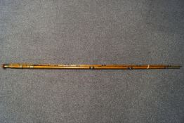 A 19th century three section, salmon fishing rod 17' long, brass banded and engraved Wm.