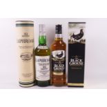 A bottle of Laphroaig single malt whisky and a bottle of Black Grouse blended whisky