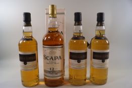 Four bottles of whisky comprising three bottles of Lochruan 12 year old whisky, 40% proof,