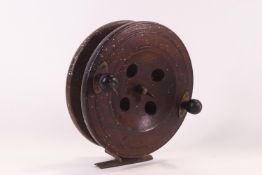 A large vintage 7" wooden fishing reel